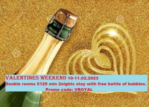 a poster of a bottle of champagne on a gold background at The New Royal Windsor Hotel in Blackpool