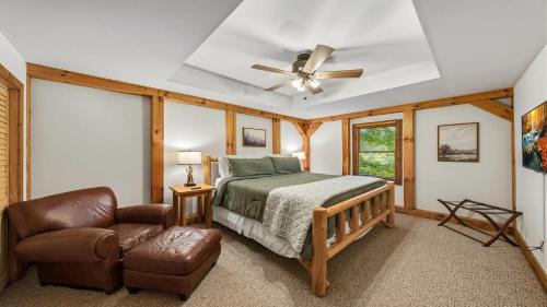 a bedroom with a bed and a ceiling fan at Hillside Hideaway in Sevierville