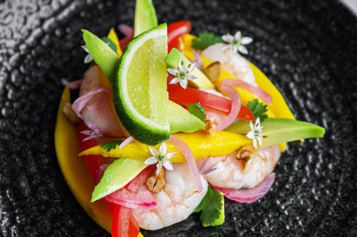 a plate of food with shrimp and vegetables on it at Fox & Hounds Country Hotel in Chulmleigh