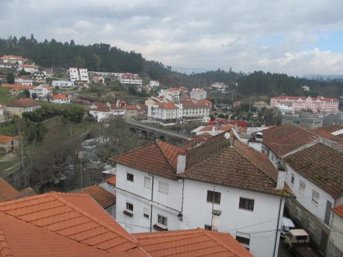 a view of a city with buildings and roofs at Hotel Solar da Capela in Termas de Sao Pedro do Sul