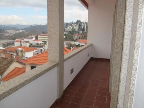 a balcony with a view of a city at Hotel Solar da Capela in Termas de Sao Pedro do Sul