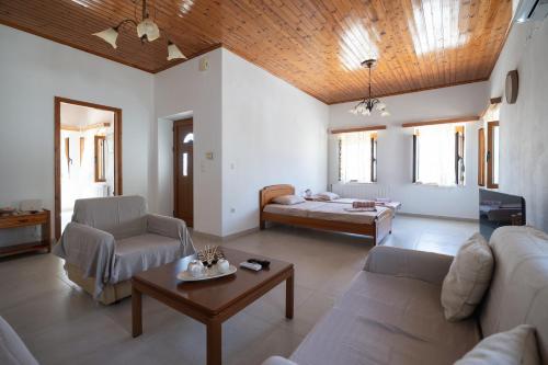 a living room with a couch and a table at Sagiada Anchor House in Sagiada