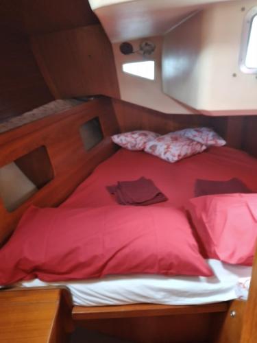 a bed in the middle of a room at Boat Experience Holiday26 in La Spezia