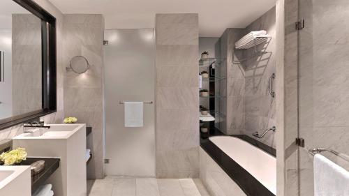 a bathroom with a shower and a sink at InterContinental Amman Jordan by IHG in Amman