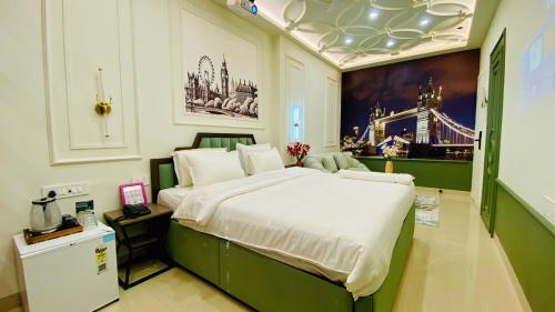 a bedroom with a large bed in a room at StayMooddy in Indore