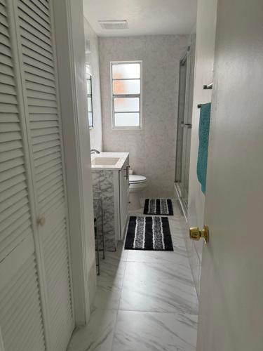 a bathroom with a sink and a tub and a mirror at Rest apartment in Jacksonville