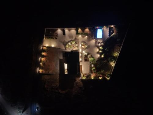 an aerial view of a house with a garden at night at Terra Della Salvia Villa with heated pool in Gouves