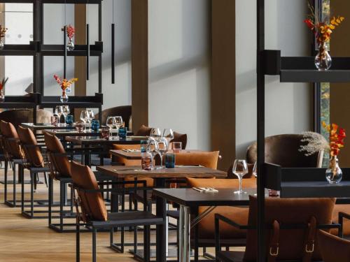 a row of tables and chairs in a restaurant at TRIBE Lyon Croix Rousse in Lyon