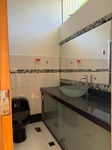 a bathroom with a sink and a toilet at 4-Bedroom Apartment in Quillabamba