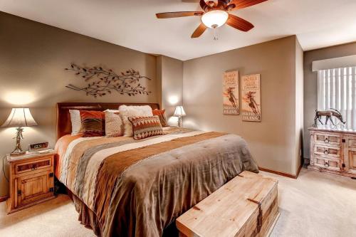 a bedroom with a bed and a ceiling fan at Seasons at Avon, A Vail Resorts Property in Avon