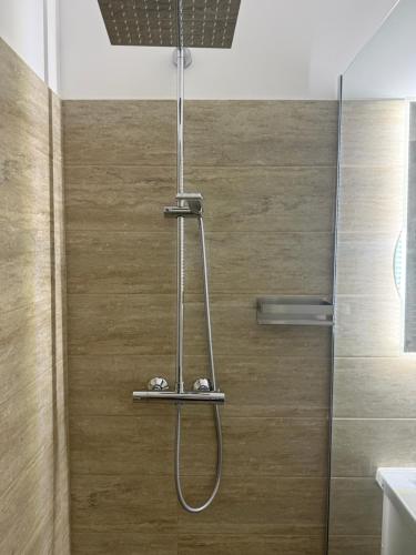a shower with a glass door in a bathroom at Cely's Ap Class Park in Târgovişte