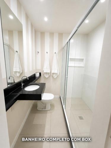 a bathroom with a sink and a shower at Maravilha in Rio de Janeiro