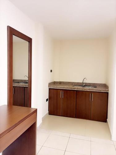 a bathroom with a sink and a mirror at Casa Herrerías Hotel & Confort in Cuenca