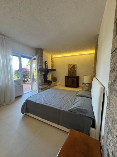 a bedroom with a large bed in a room at Villa Maria Marcella in Porto Santo Stefano