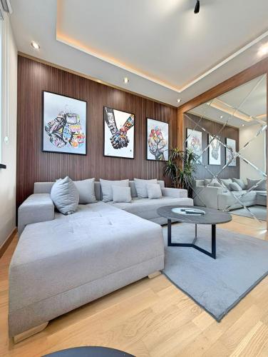 a living room with a couch and a table at BW Premium One-Bedroom Apartments in Belgrade