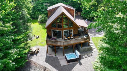 an overhead view of a house with a swimming pool at Charming 4BR Cabin - HOT TUB - Mountain View in Hoyes Run