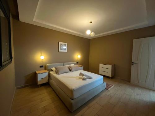 a bedroom with a large bed in a room at appartemment essaouira in Essaouira