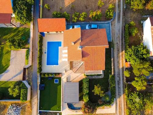 an overhead view of a house with an orange roof at Holiday Home Senko in Blagaj