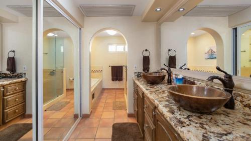 a bathroom with two sinks and a shower at Las Mañanitas LM C208 in San José del Cabo