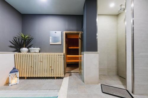 a hallway of a building with a door at Perla Residence Hotel & SPA in Podgorica