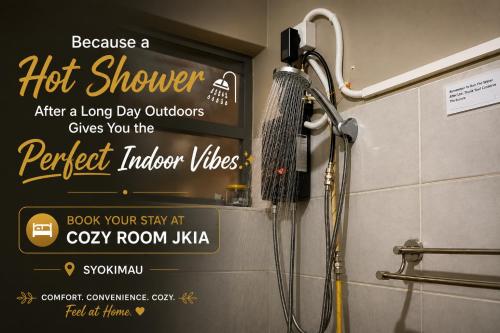 a shower in a bathroom withbecause a hot shower after a long day at Cozy Rooms JKIA -Games Nights - Gated - Secure -3 Bedroom -5 Beds -2Baths -15Mins to JKIA-SGR in Syokimau