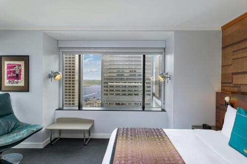 a hotel room with a bed and a window at W Seattle in Seattle