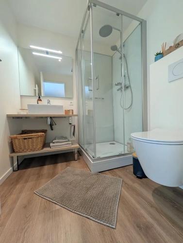 a bathroom with a shower and a sink and a tub at Agréables chambres indépendantes - Coutances centre in Coutances