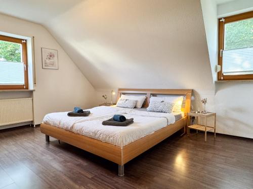 a bedroom with a bed with two towels on it at Ferienwohnung Weiher - Nähe Nürnberg / Messe in Schwanstetten