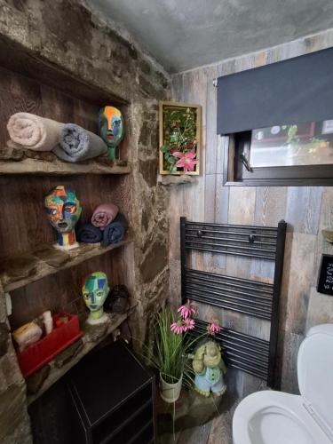 a bathroom with a sink and a toilet and towels at Casa Anne Boutique in Braşov