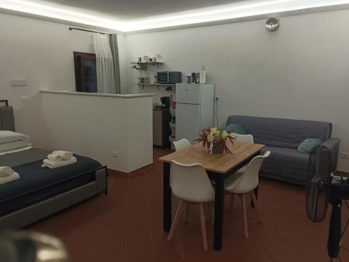 a living room with a table and a couch at Antiche Mura in Celano