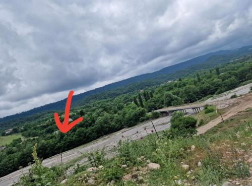 a red x on a road in a field at GreenHouse in Qusar