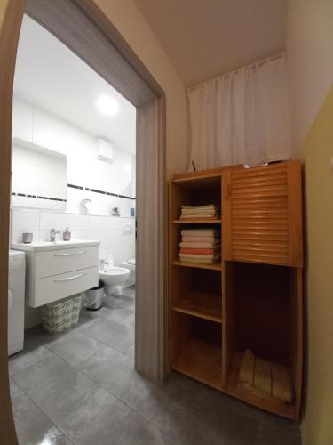 a bathroom with a toilet and a sink at Idila in Izola