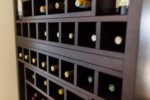 a bunch of wine bottles in a wine cellar at Apart Hotel Sea Fort in Sutomore