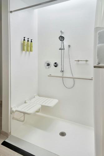 a white bathroom with a shower and a sink at Element by Marriott Bainbridge Riverfront in Bainbridge
