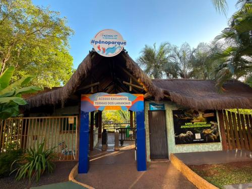 a building with a sign in front of it at Thermas de Olimpia Resort in Olímpia