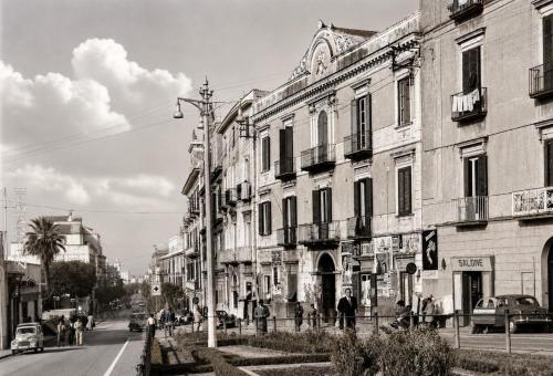 a black and white photo of a street with buildings at Villa Lucia in Torre del Greco