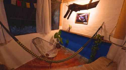 a room with a tennis racket and a net at Mariposa - Casa Corazon Mazunte in Mazunte