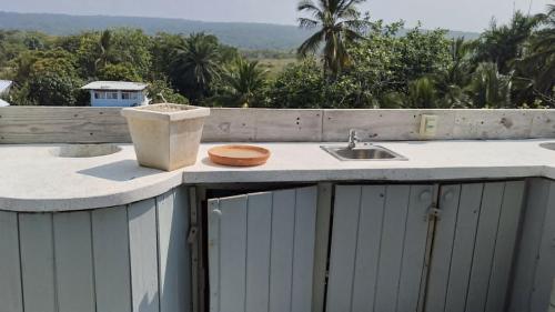 a kitchen counter with a sink on a roof at Blue Flamingo Kite Beach in Cabarete