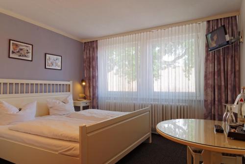 Ένα ή περισσότερα κρεβάτια σε δωμάτιο στο Landhotel Michaelishof