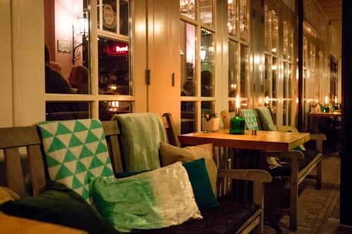 a dining room with a table and a table and chairs at Hotel Restaurant Taverne in Twello