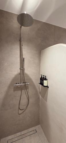 a shower in the corner of a bathroom at Sea Breeze Mykonos in Mykonos