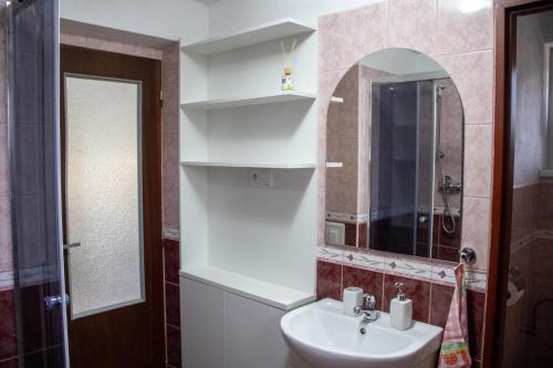 a bathroom with a sink and a mirror at Privat Kovacova in Žiar