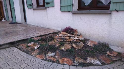 a rock garden in front of a building at L'écume du Cher in Bléré