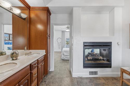 a bathroom with a fire place in a fireplace at Sea Manor in New Smyrna Beach