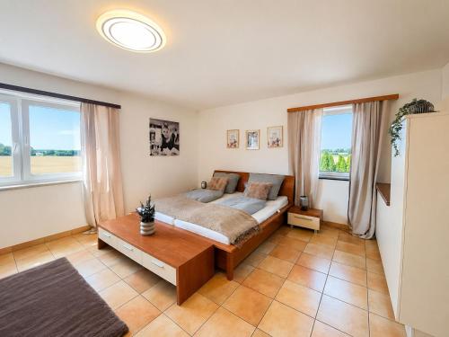 a bedroom with a bed and a table at Faraway Homes Studios Eberstalzell in Eberstalzell
