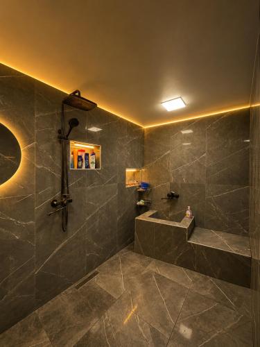 a bathroom with a shower and a sink at Sheki Panorama Garden in Sheki