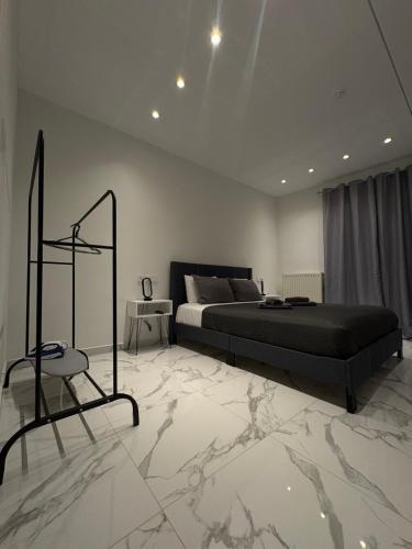 a bedroom with a bed and a marble floor at Αικατερίνα in Kozani