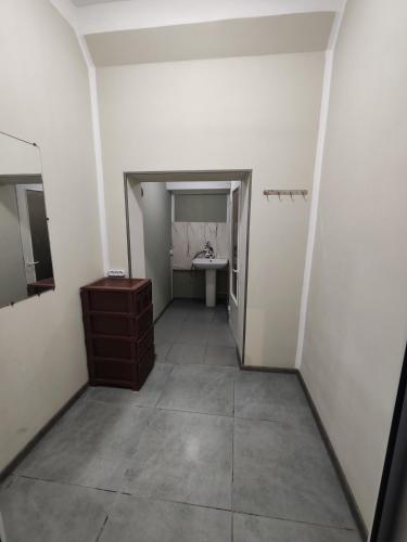 an empty bathroom with a sink and a mirror at MG guest house in Geghanist