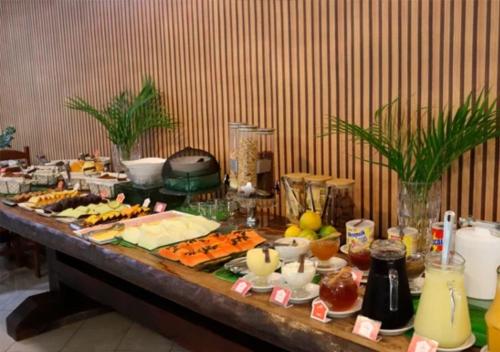 a buffet with many food items on a table at Hotel Casa Encantada in Penedo