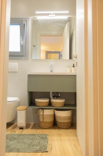 a bathroom with a sink and a mirror at Paul's Horizon in Chios